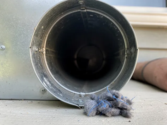 Madison Dryer Vent Cleaning technician using specialized equipment to clear severe dryer vent blockage in Madison